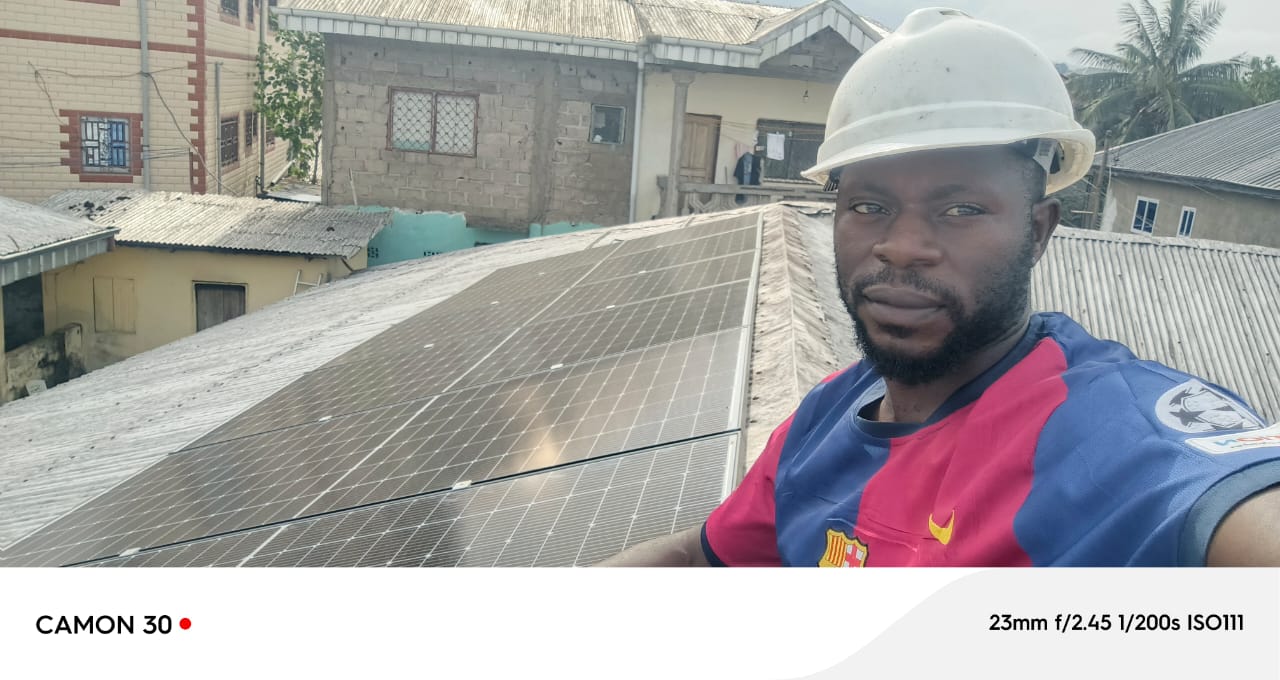 SLT Energies engineer on solar panel roof